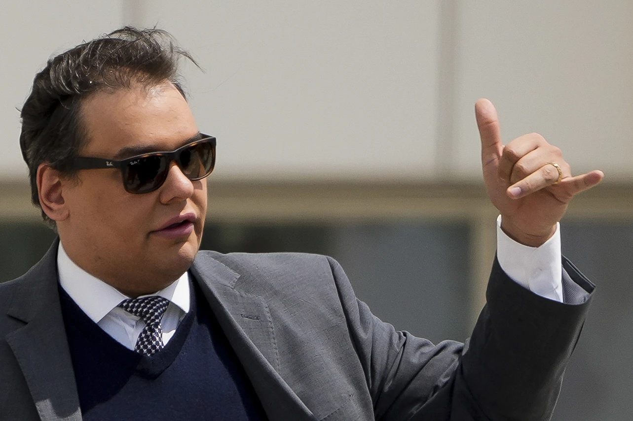 George Santos Refers to DOJ After Betting Against State of the Union Attendance","description":"A prediction market flagged suspicious trades by former House member George Santos, prompting a referral to the Department of Justice.","summary":"Former U.S. Representative George Santos, who had reportedly bragged about attending President Donald Trump’s State of the Union address, was flagged by the prediction‑market platform Kalshi for suspicious trades indicating he would not attend. Kalshi reported the activity to the U.S. Department of Justice and the Commodity Futures Trading Commission, both of which are tightening enforcement of insider trading in prediction markets. Santos, who has faced multiple criminal charges and a federal prison sentence, declined to discuss his Kalshi account and has been unresponsive to inquiries. The incident follows broader scrutiny of betting platforms like Kalshi and Polymarket, amid calls from lawmakers to curb insider trading in these markets.","image":"","text":"<p>NEW YORK (AP) — A prediction market reported U.S. Rep. George Santos to federal prosecutors after he boasted he’d be going to President Donald Trump’s State of the Union address, then bet against his own attendance, according to a person familiar with the investigation.</p>\n<p>Kalshi, the online prediction marketplace, referred Santos to the Department of Justice after detecting suspicious trades made by the former congressman ahead of Trump’s February 24 speech, the insider said. The source spoke to The Associated Press on the condition of anonymity because they were not authorized to discuss the matter publicly.</p>\n<p>Kalshi also reported the trades to the Commodity Futures Trading Commission, a federal regulatory body that has vowed to crack down on insider trading in prediction marketplaces.</p>\n<p>The Justice Department and the CFTC did not immediately respond Tuesday to inquiries from the AP.</p>\n<p>Santos also did not respond to text messages or phone calls.</p>\n<p>The referral was first reported by NPR. Santos told NPR that he wasn’t aware of the investigation. He declined to say whether he had a Kalshi account.</p>\n<p>“I’m not saying yes, I’m not saying no,” Santos told NPR.</p>\n<p>The convicted ex‑congressman had repeatedly discussed his intention to attend the State of the Union, which came just four months after he was granted clemency by Trump in a fraud case that led to his expulsion from the U.S. House.</p>\n<p>On the eve of Trump’s speech, Kalshi put the odds of Santos attending at close to 75%. Then, minutes into the speech, Santos posted on X that he had been waylaid at the airport. Immediately, several social media users accused him of running another scheme.</p>\n<p>In March, Santos addressed the complaints on his podcast.</p>\n<p>“I guess people lost money,” he said. “Some people made unexpected money. That’s to show you how fragile these markets are.”</p>\n<p>Santos, who won office as a Republican after inventing a bogus persona as a Wall Street dealmaker, was sentenced to seven years in prison after pleading guilty to fraud and identity theft in 2024.</p>\n<p>After serving just 84 days, he was ordered released by Trump, who called Santos a “rogue” but said he didn’t deserve a harsh sentence and should get credit for voting Republican.</p>\n<p>Prediction markets, including Kalshi and its chief rival Polymarket, have drawn scrutiny as their businesses have expanded— with some lawmakers urging the platforms to do more to guard against insider trading.</p>\n<p>Both companies have said they are reporting suspicious trades to federal regulators. Some investigations have led to criminal charges. In April a soldier involved in the military operation to capture Venezuelan President Nicolás Maduro was charged with using classified information to win more than $400,000 predicting the date of his capture on Polymarket.</p>\n<p>In April, the Senate approved a bipartisan resolution to prevent its own members from using prediction markets.</p>