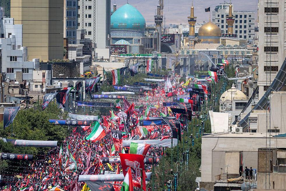 Massive crowds gather for burial of Iran's late Supreme Leader