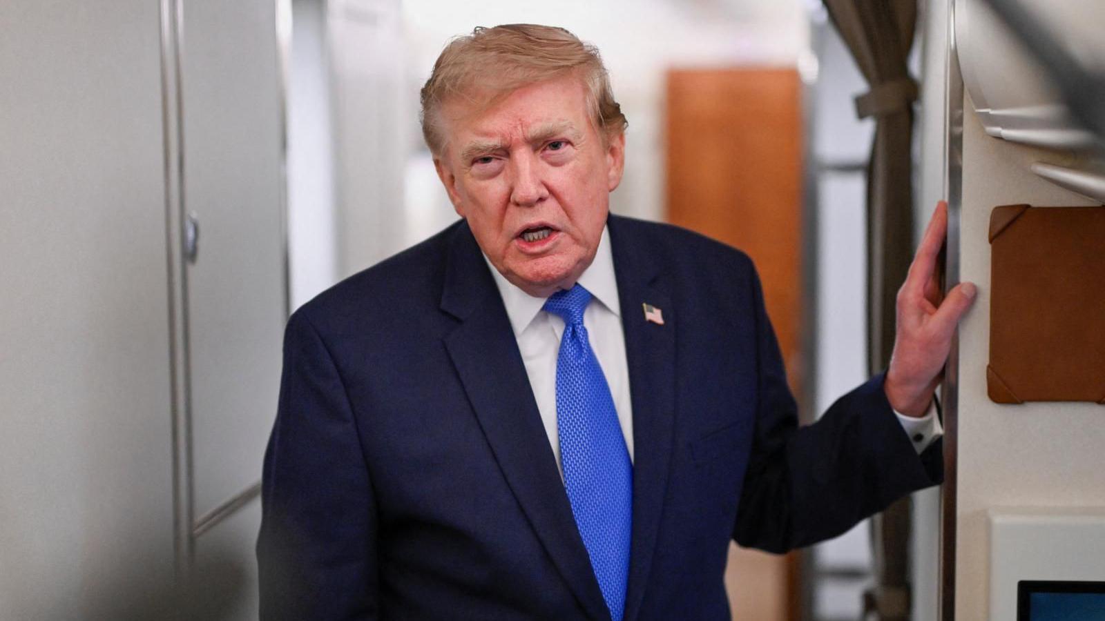 President Trump speaking on Air Force One