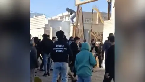 Violence Erupts in Iran: Security Force Member Killed Amid Protests