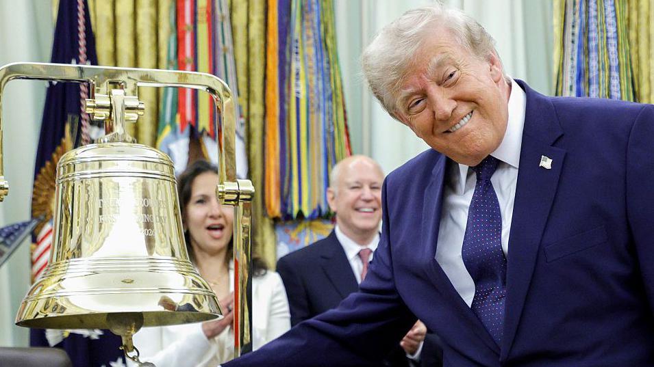 President Donald Trump ringing the opening bell in the Oval Office