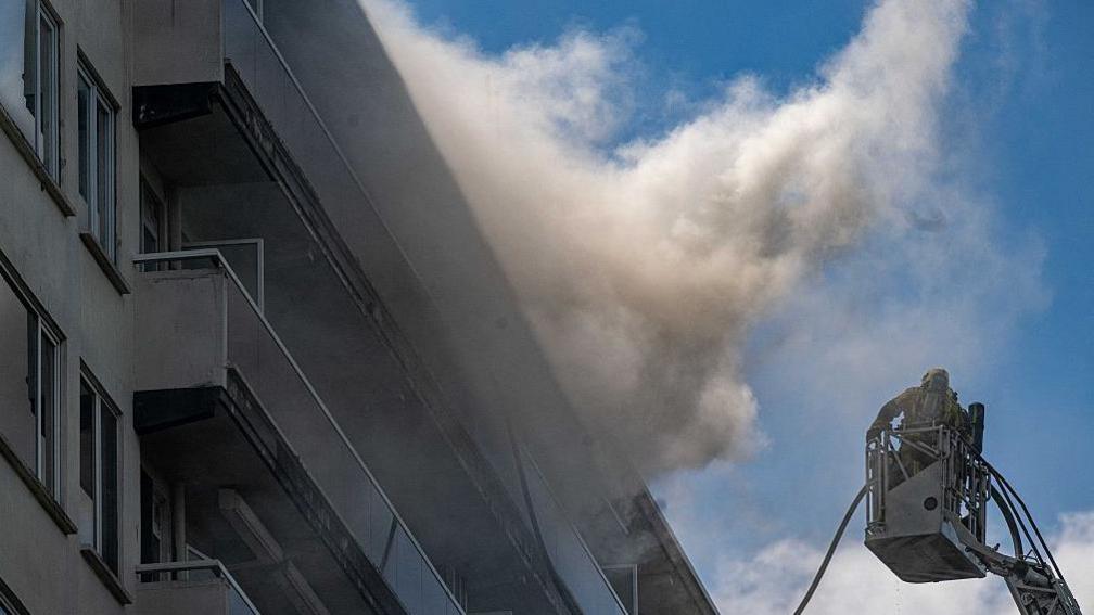 Firefighters at Antwerp apartment building
