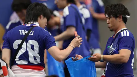 Japanese Football Fans Clean Stadiums, But Critics Say Men Should Pitch In More at Home