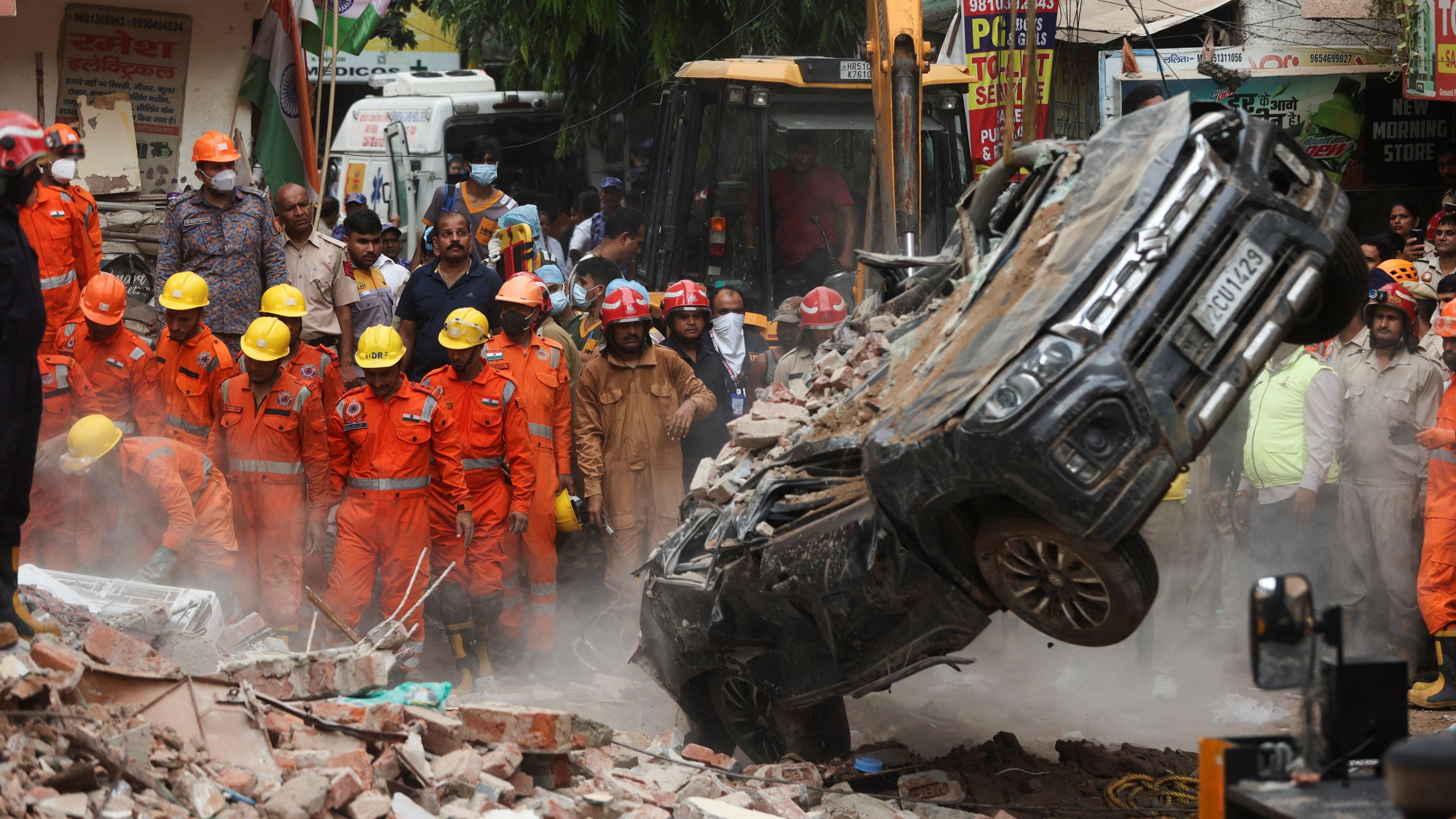 Dozens Trapped in Delhi Building Collapse