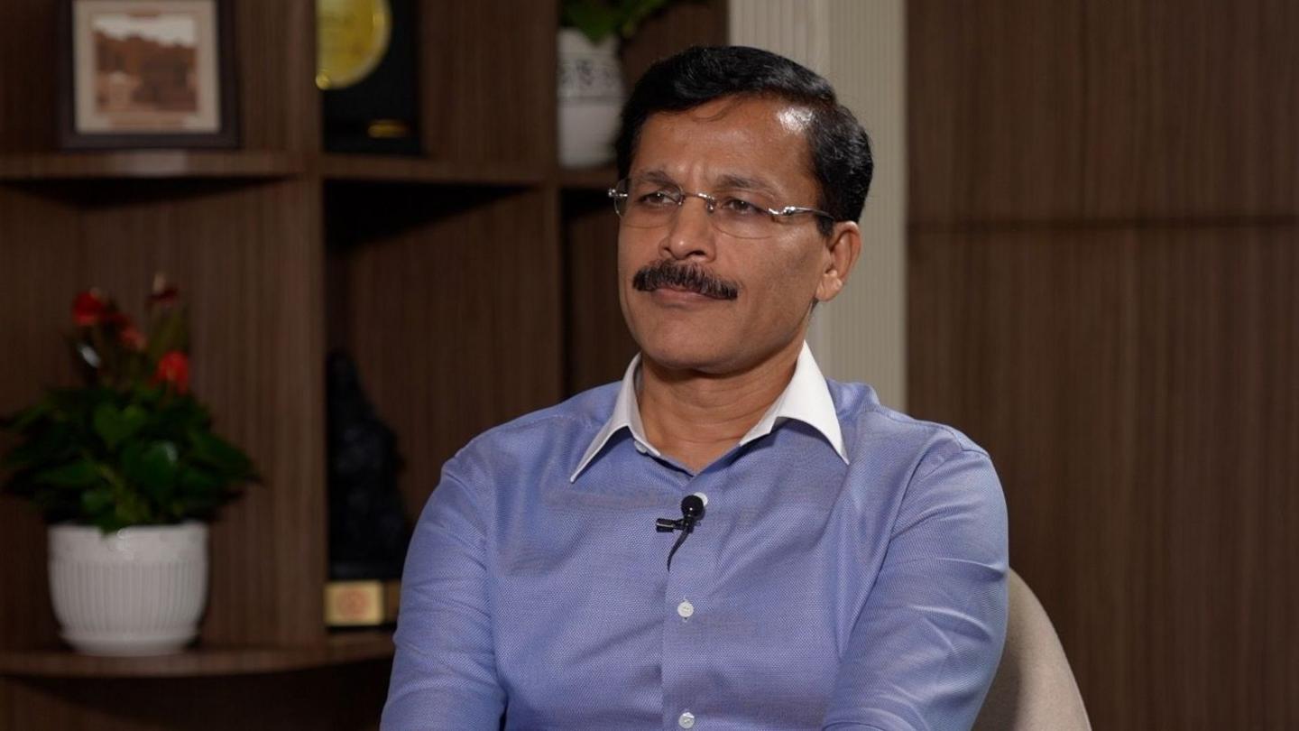 Tukaram Mundhe wearing a blue shirt and black glasses